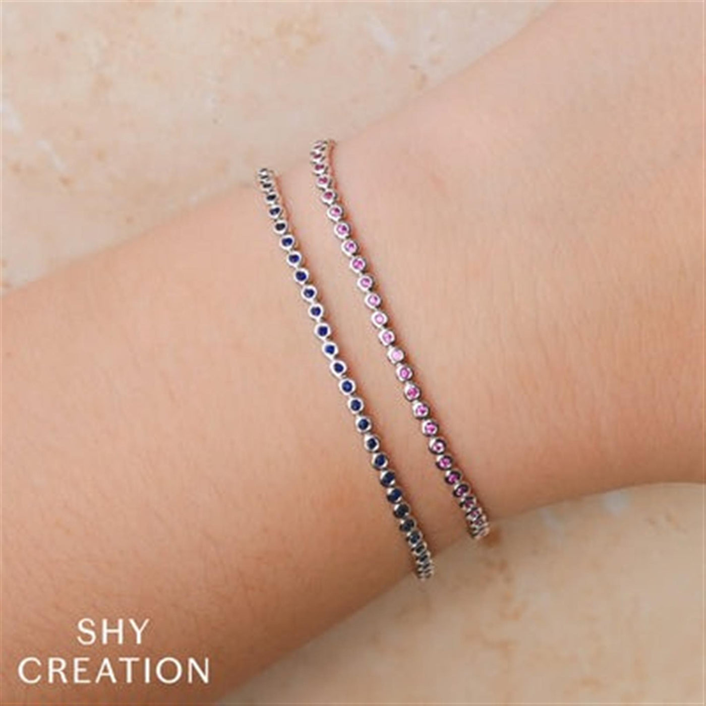 Shy Creation 14K White Gold 7" Bezel Set Tennis Style Bracelet Featuring Pink Sapphires