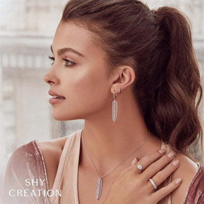 Shy Creation 14K White Gold .04ctw Classic Huggie Style Diamond Earrings