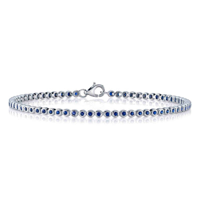 Shy Creation 14K White Gold 7" Bezel Set Tennis Style Bracelet Featuring Sapphires